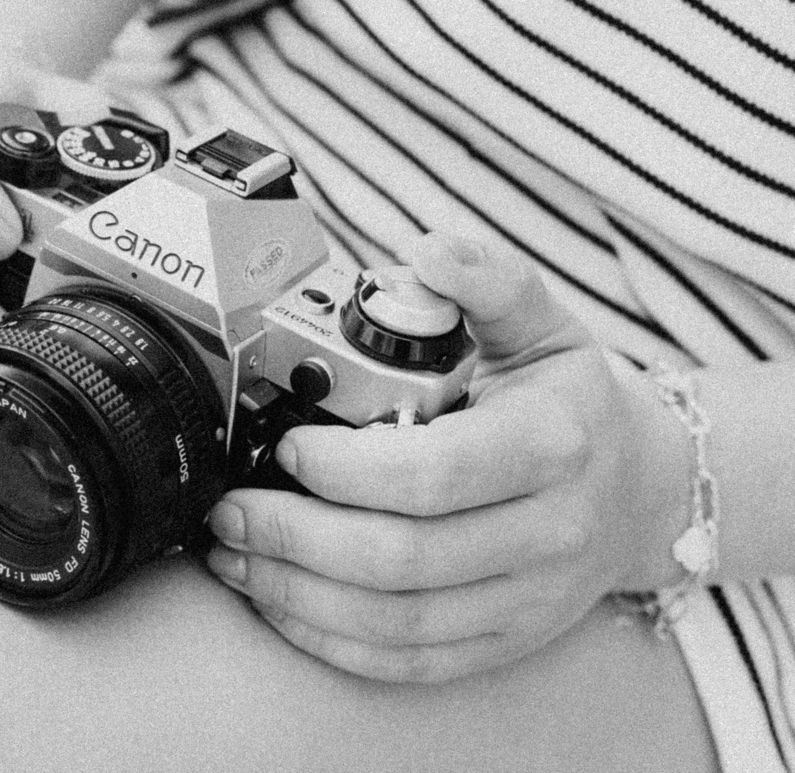 Black and white image of film camera.